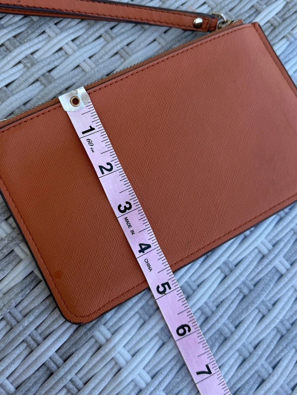 kate spade wristlet clutch in rust orange